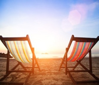 two beach chairs on beach