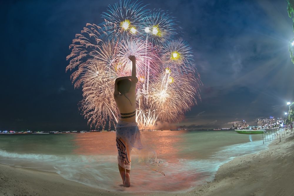 Girl on Beach during fireworks